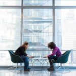 Two people sitting at a table